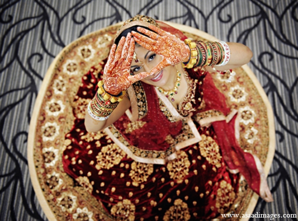 The brides showcases her traditional Indian mehndi, lengha, and jewelry before the ceremony.