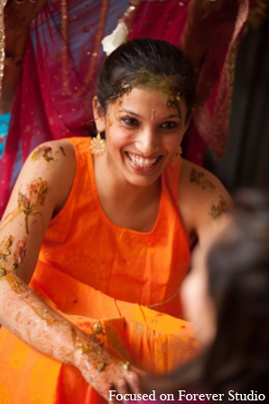 Turmeric paste is applied to the bride\'s skin during the gaye holud.