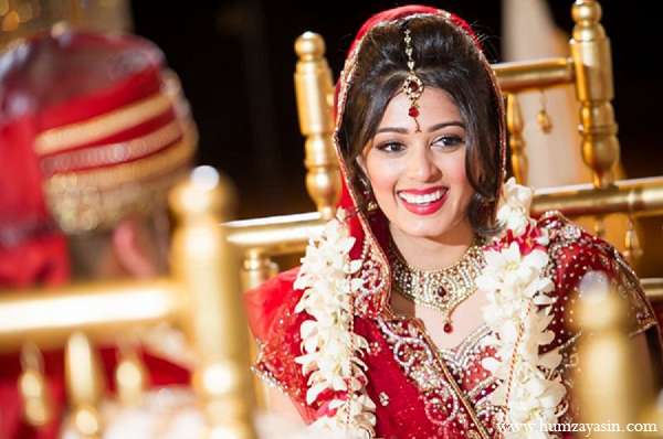 indian wedding ceremony bride makeup hair red sari traditional