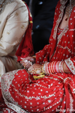 The bride and groom take part in both Christian and Sikh wedding traditions.