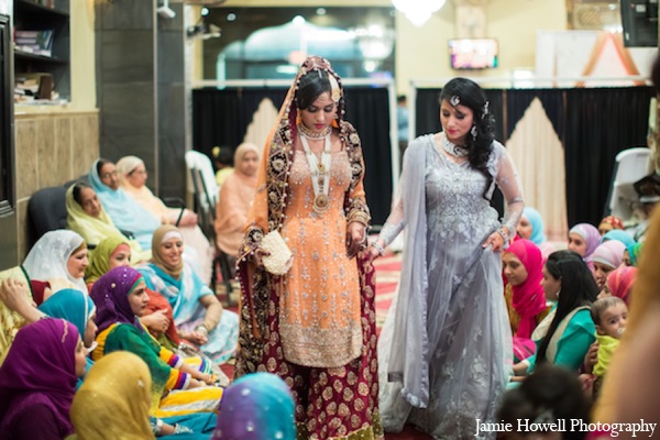 A south Asian bride and groom marry in a traditional Muslim wedding ceremony. They celebrate many Muslim traditions with friends and family throughout the glamorous festivities.