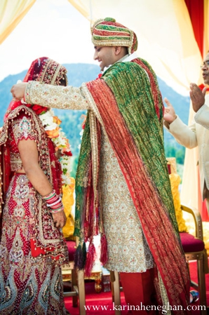 indian-wedding-groom-places-jai-mala-on-bride