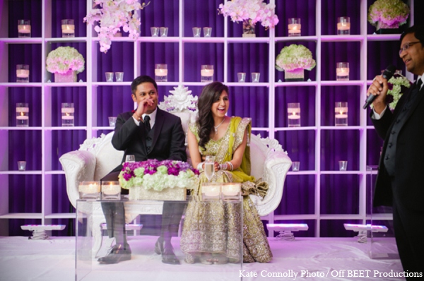 The Indian bride and groom enjoy their wedding reception.