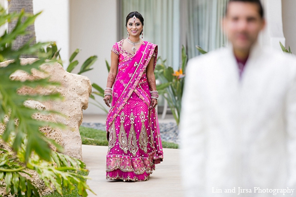 indian wedding bride pink sari first look groom