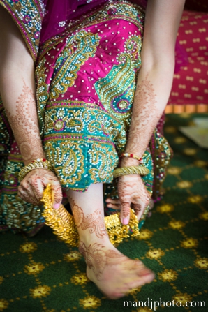 indian wedding bride getting ready henna