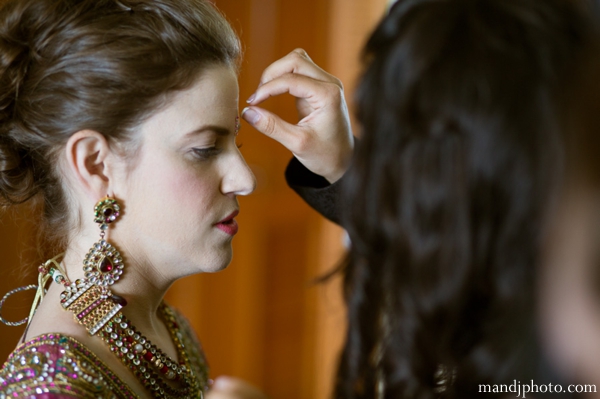 indian wedding bride getting ready traditional jewelry