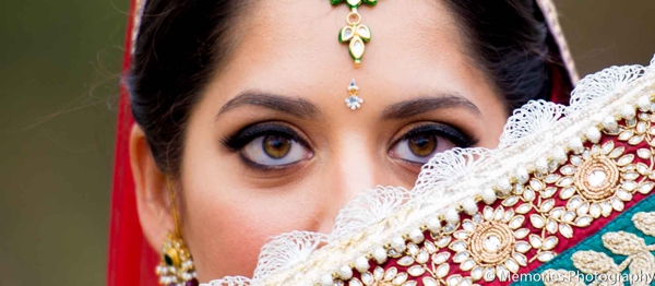 A close up of the bridal makeup and jewelry.