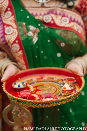 The Indian bride and groom partake in traditional wedding rituals and customs.