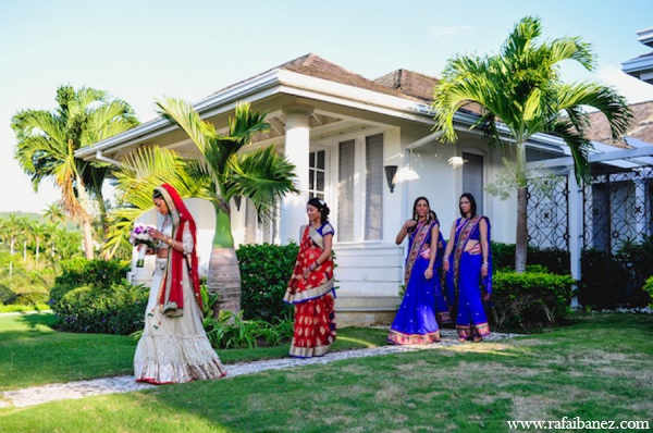 The Indian bridal party leave the quaint bridal bungalow at the Tryall Club.