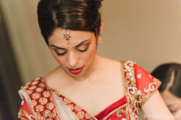 indian wedding bride getting dressed traditional