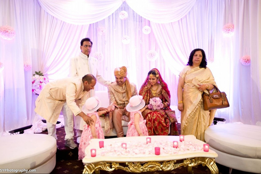 Indian-wedding-reception-pink-kissing-balls-white-stage-1