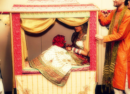 Indian wedding dholi entrance bride