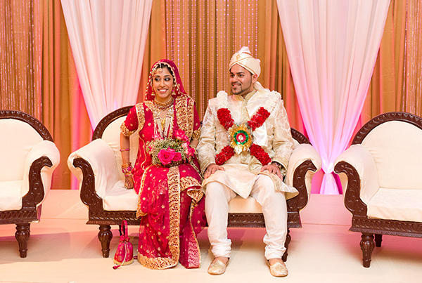 An Indian bride and groom at their Indian wedding reception.