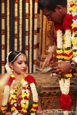 Indian wedding ceremony with a indian bride in a traditional south indian sari.