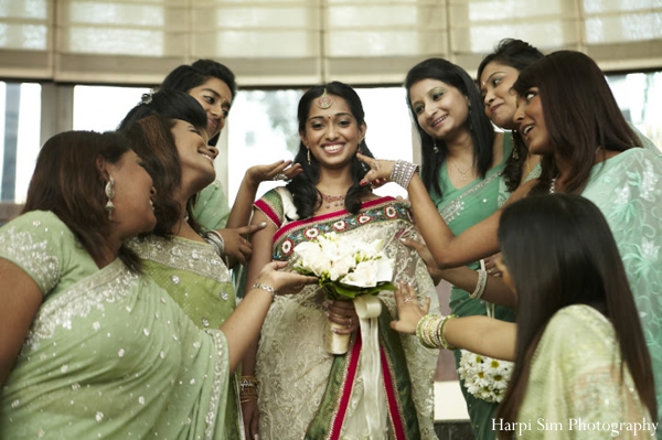 Indian bride and bridesmaids in green bridal saree fashion.