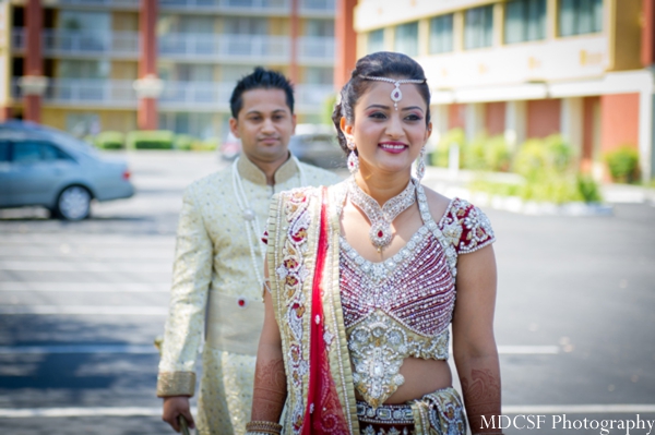 Indian wedding photography captures first look photo with indian bride and groom.