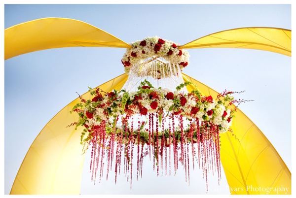 Floral centerpiece chandelier for an outdoor modern mandap.