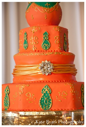 Indian wedding cake ideas for orange and green cake with jewels.