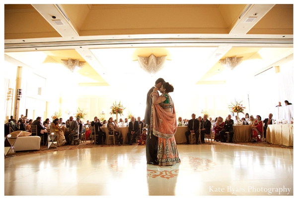 Indian bride and groom dance at a modern indian wedding reception.
