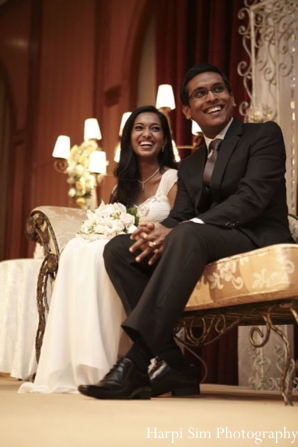 Indian bride and groom at their modern indian wedding reception.
