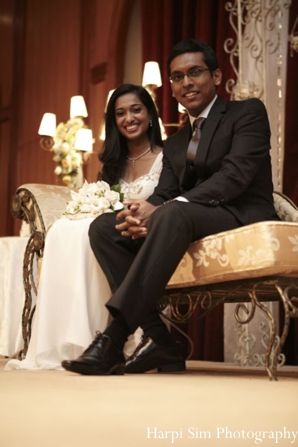 Indian bride and groom have portrait taken by professional indian wedding photographer.