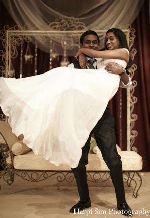 Indian bride and groom at their modern indian wedding reception.