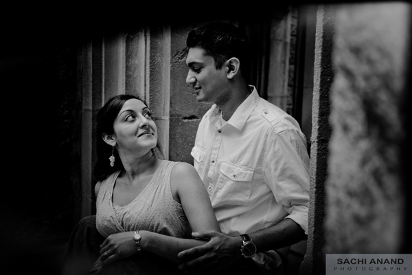 Black and white engagement photo of Indian bride and groom.