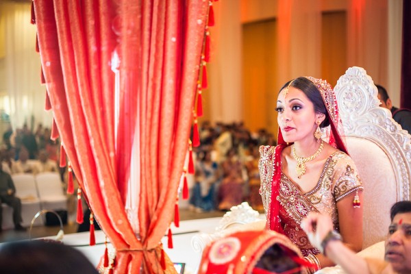 An Indian bride waits for her Indian groom at her Indian wedding ceremony.