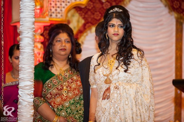 An Indian bride is a white bridal sari.