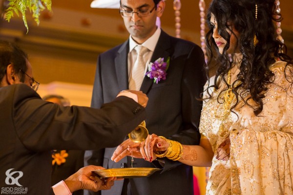 An Indian bride and groom at a fusion Indian wedding.