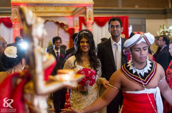 An Indian bride and groom leave their fusion indian wedding.