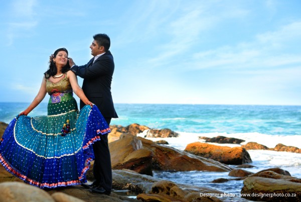 An Indian bride and groom with their beachside engagement photos.