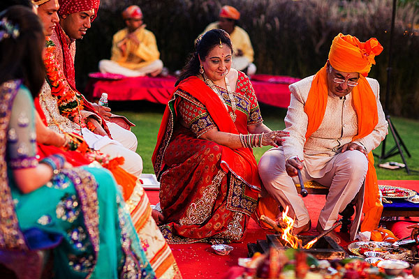 Relatives of the Indian bride and groom at their Indian wedding altar.