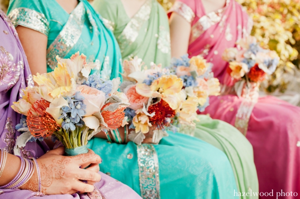 Indian wedding ideas include bright bridal saris and colorful wedding bouquets.