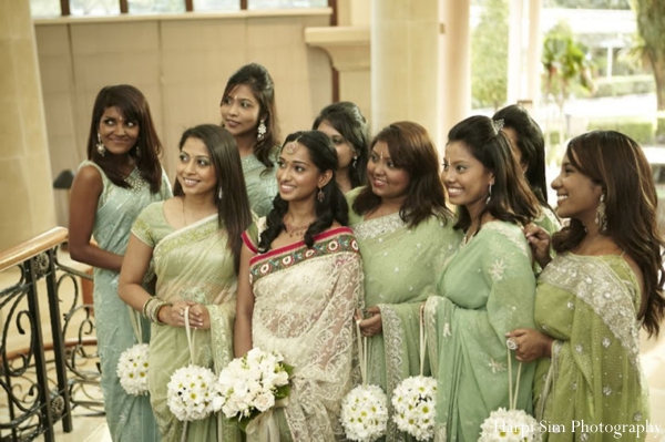 An Indian bride and her bridesmaids wear green bridal sarees at this Indian wedding.