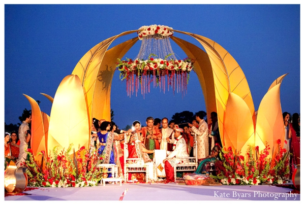 Floral decorations under a modern mandap at this indian wedding.