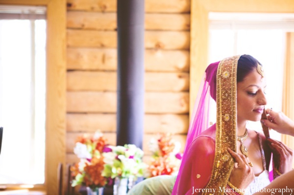 An indian bride gets ready for her outdoor indian wedding.