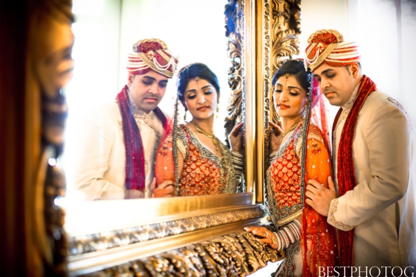 An Indian bride and groom embrace in these Indian wedding photography set.