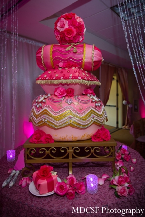 Indian wedding cake pillow stack at modern Indian wedding reception.
