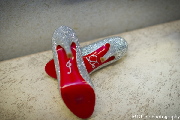 Indian bridal shoes in silver with initial gems at the sole.