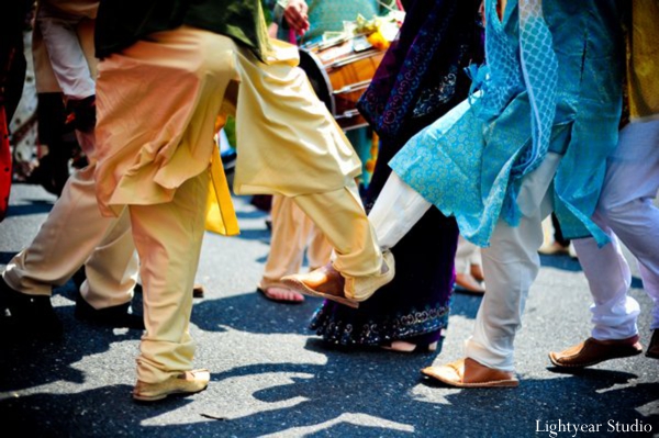 Indian wedding baraat dancing on the street.