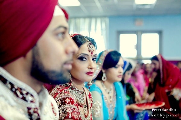 Indian bride at her Sikh indian wedding with hair and makeup ideas.