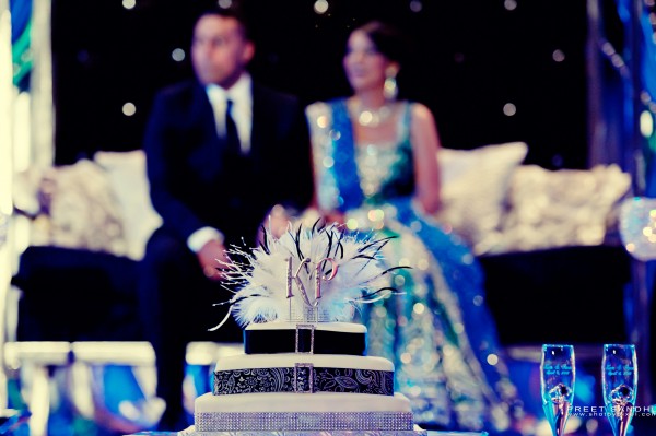 Indian wedding cake topper made with feathers.