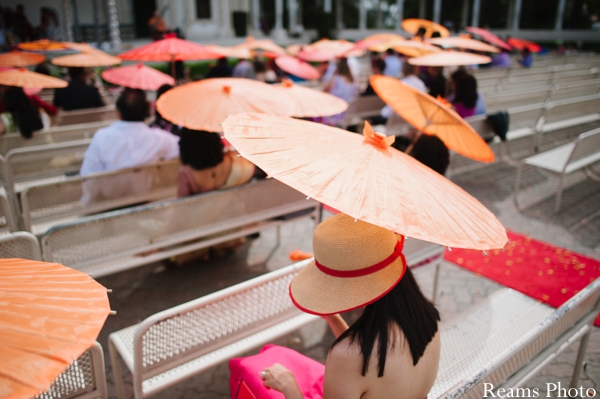 Umbrellas at an outdoor indian wedding ceremony.