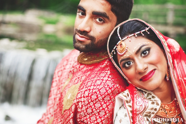 Indian bride and groom in traditional indian wedding outfits.