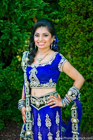 Indian bride in blue bridal lengha fashion.