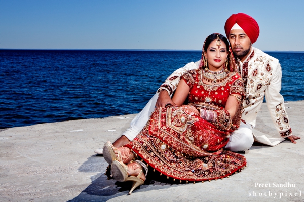 Indian bride and groom by the sea.