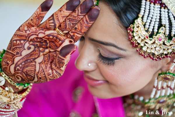 indian bride with bridal mehndi on hands.