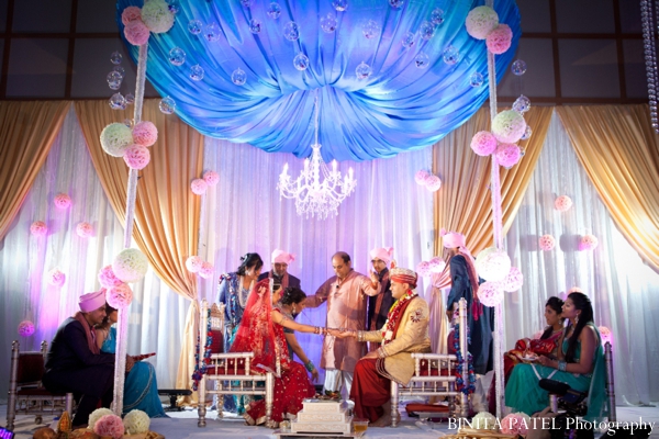 A modern mandap is the centerpiece of this indian wedding ceremony.