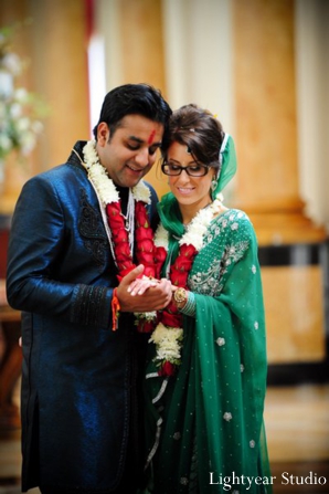 Indian bride and groom in modern Indian wedding wear.